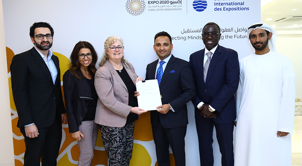 Sajid Barkat, CEO, AS World Group, 3rd from right, being awarded the authorised ticket reseller contract by Lisa Caudana, Director, Ticketing, Sales and Marketing, Expo 2020 Dubai