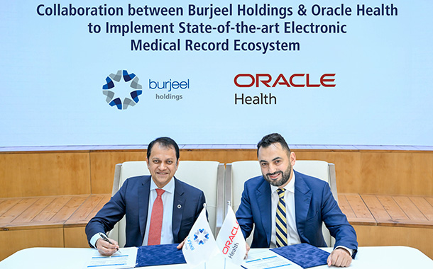 Mr. John Sunil, CEO, Burjeel Holdings (L) and Mr. Alaa Adel, Senior Vice President, and Managing Director - International, Oracle Health, (R) signing the agreement during a ceremony at Burjeel Medical City