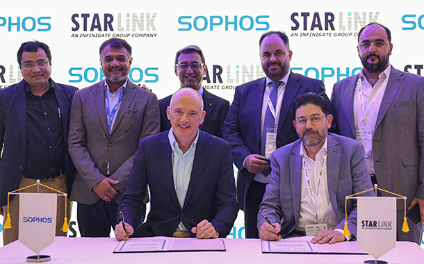 Senior executives from Sophos and StarLink signing the agreement